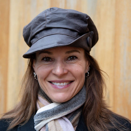 brown-wax-baker-boy-cap-with-large-button-on-side-of-cap